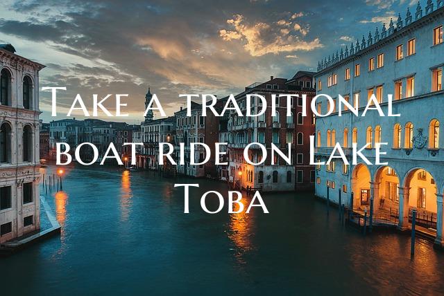 Take a traditional boat ride on Lake Toba